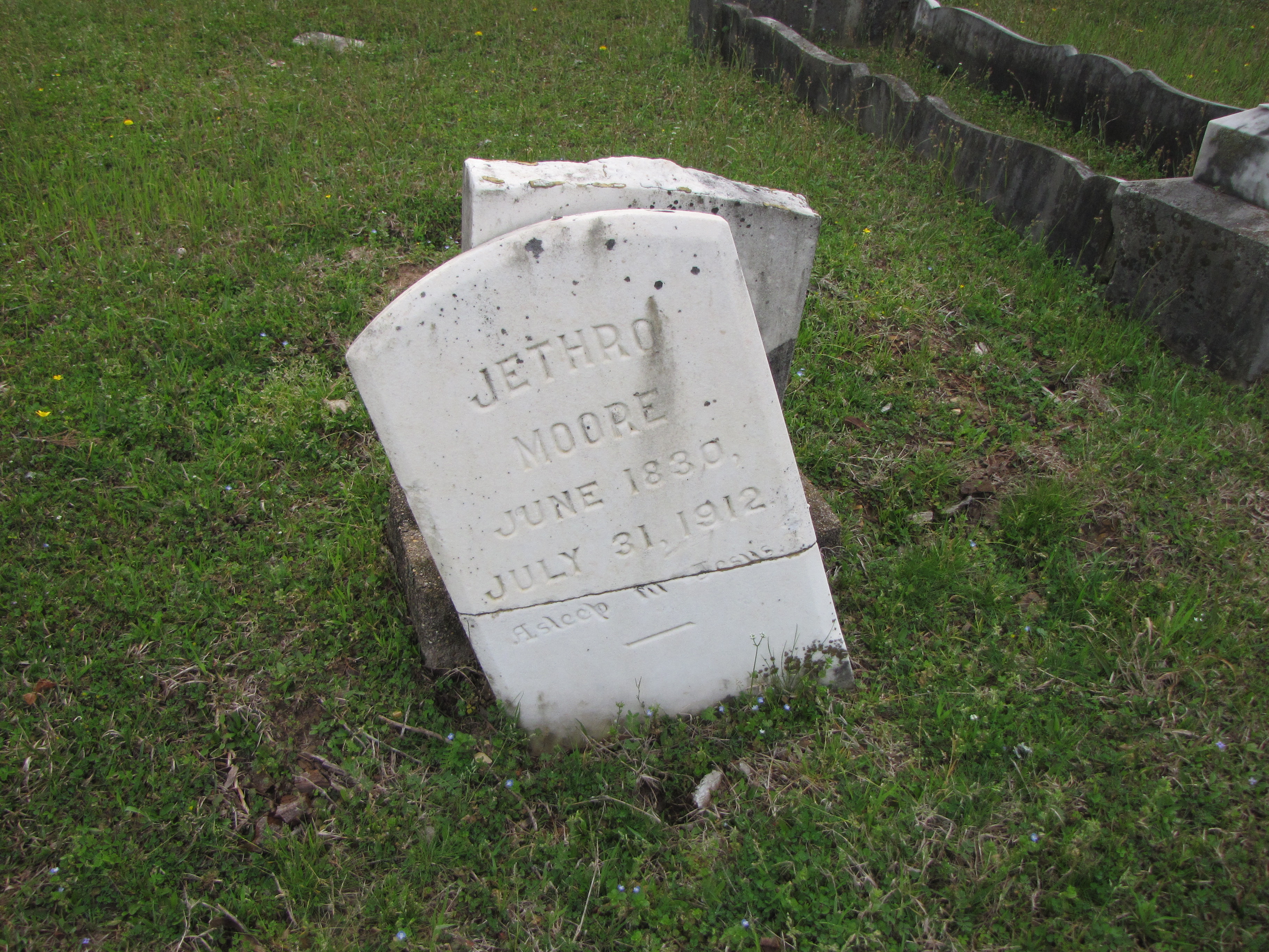 Image of a broken marble monument